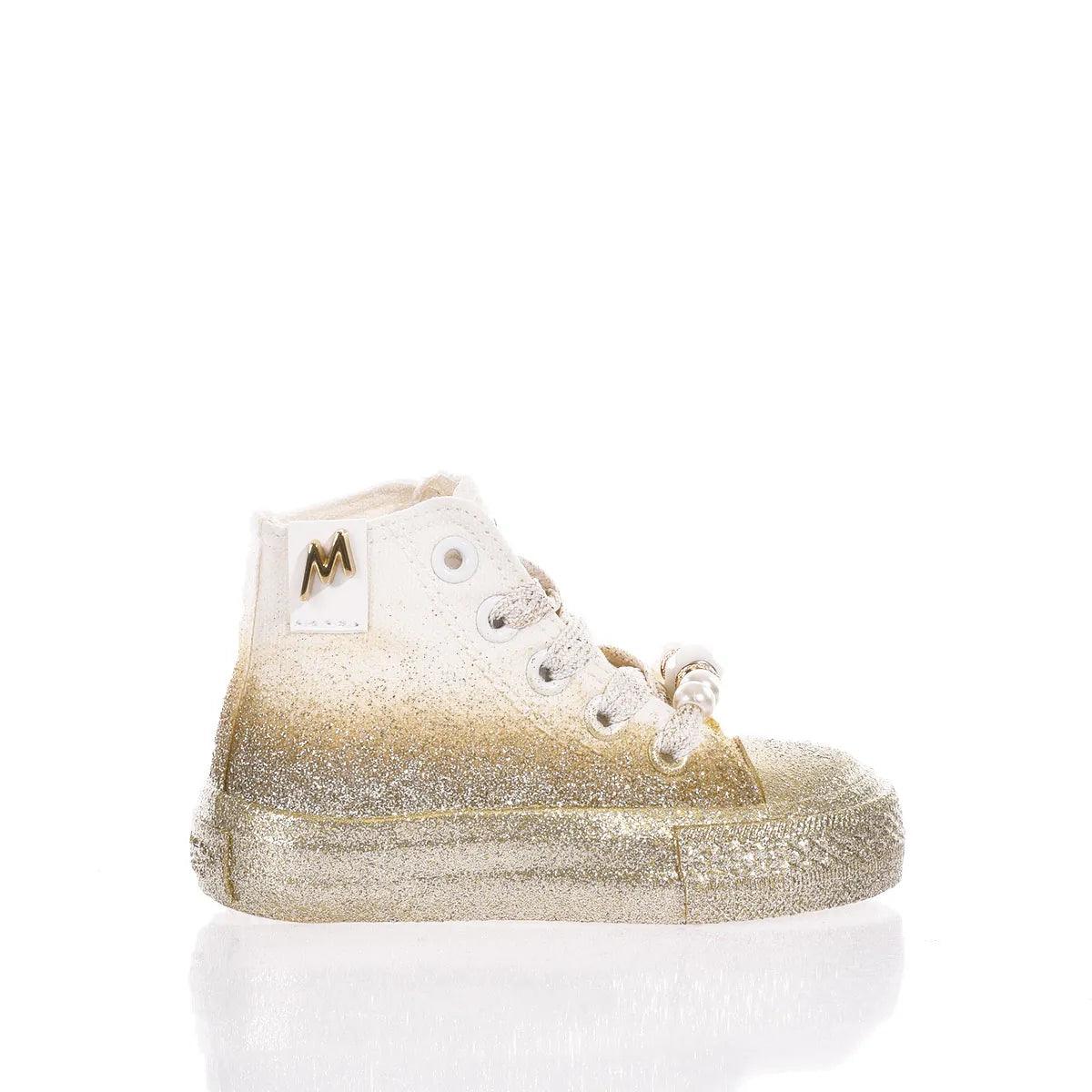 Sneaker bambino glitter oro e bianca, ideale per outfit premaman eleganti e confortevoli.