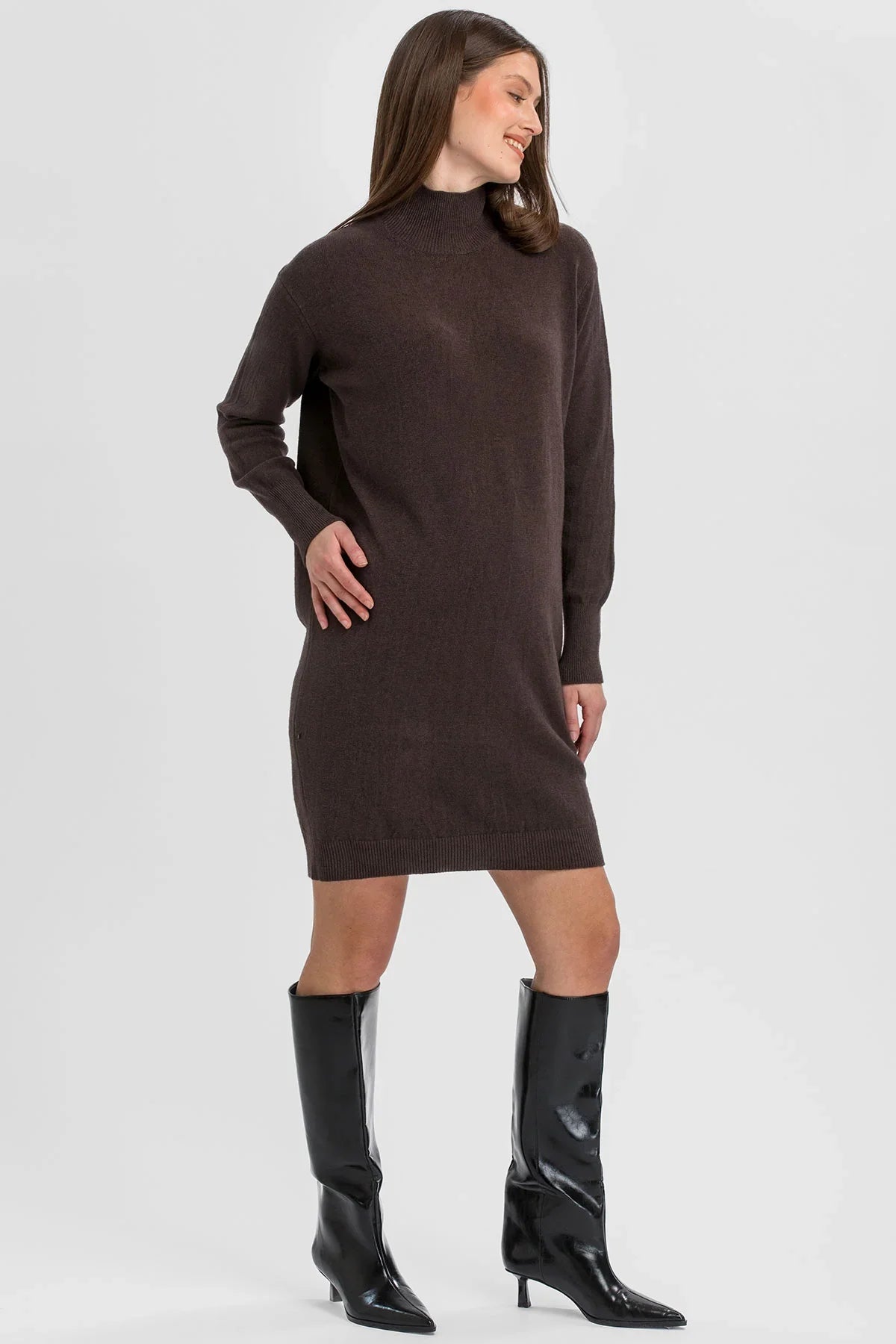 Brown maternity knit dress with high neck.