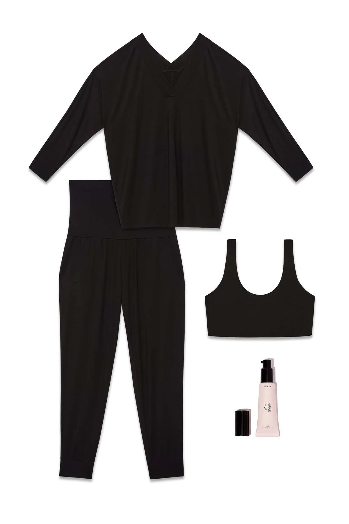 Set regalo abbigliamento premaman nero: maglia, pantaloni, reggiseno e crema.