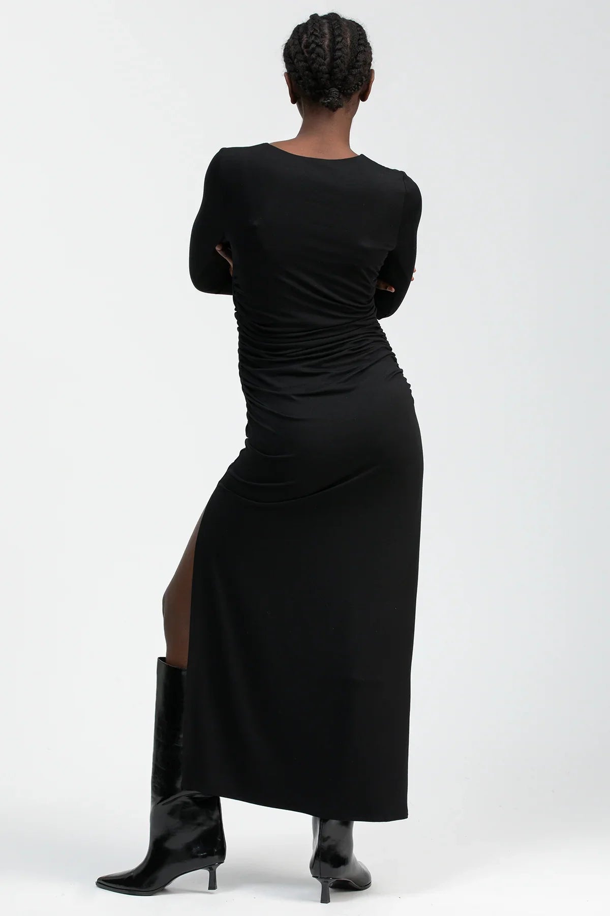 Black maternity dress with a round neckline, side ruching and a fitted silhouette