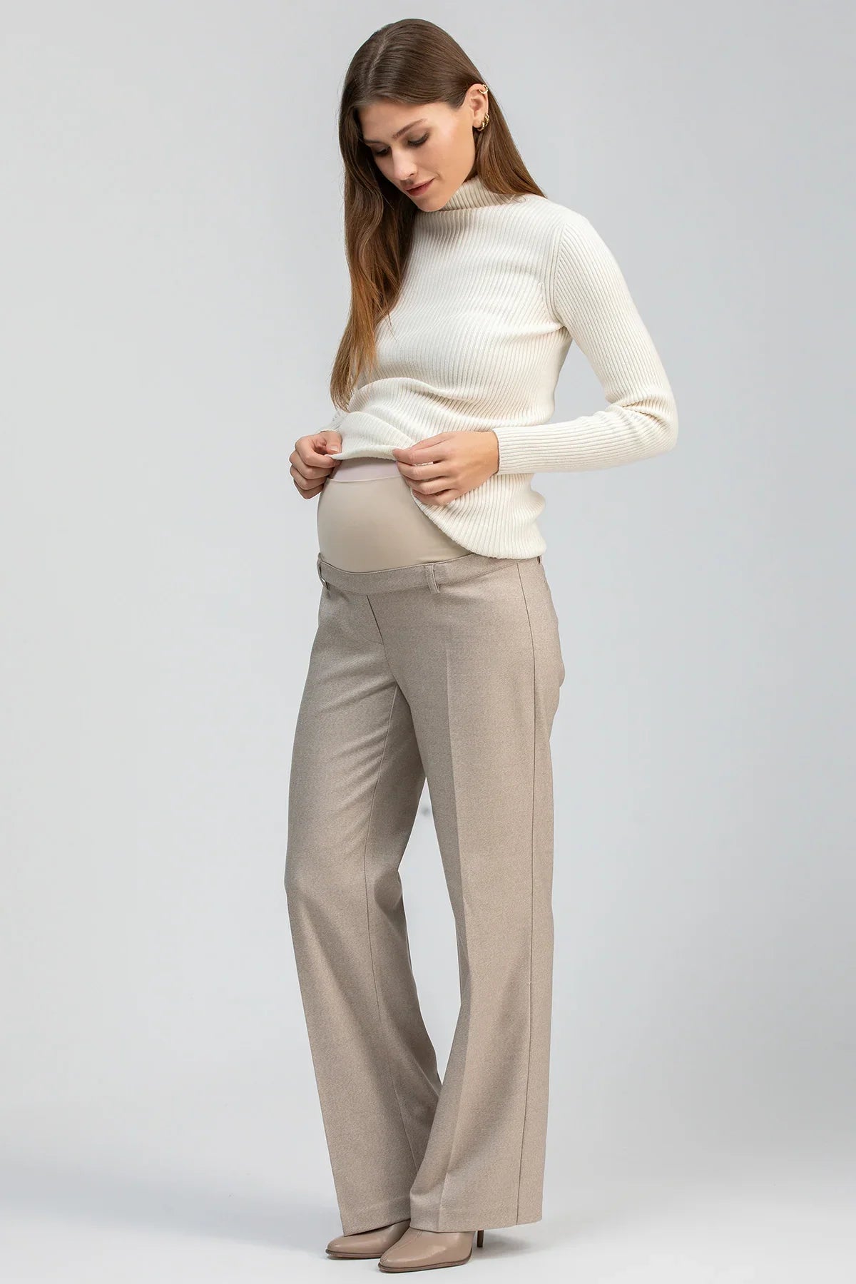 Cream fitted maternity sweater with long sleeves and a ribbed turtleneck