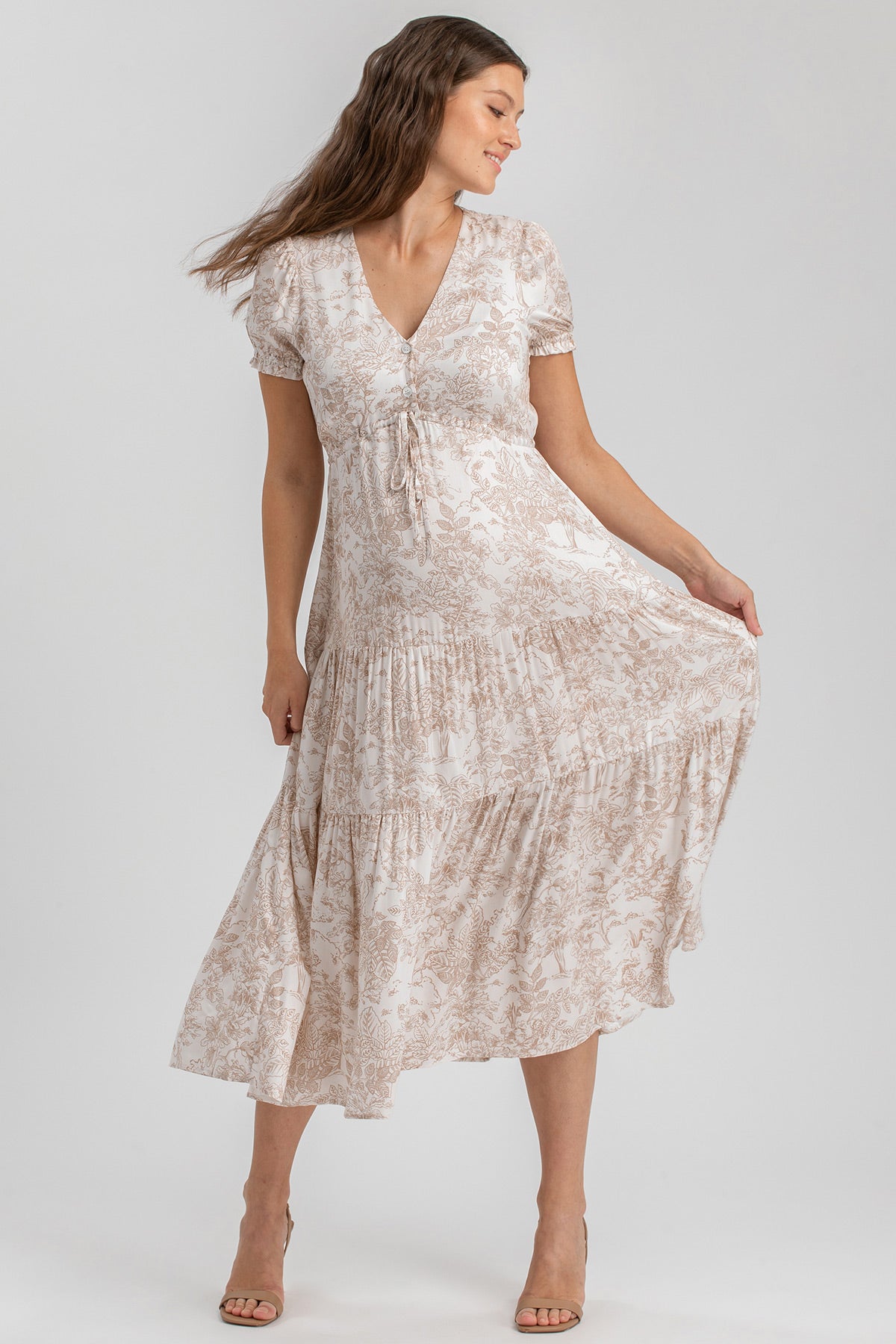 Abito premaman lungo floreale beige con maniche corte, ideale per gravidanza elegante